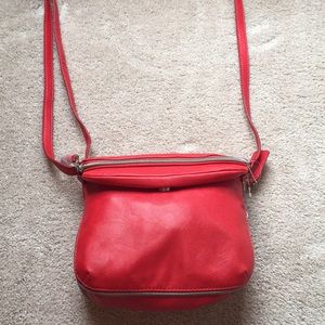 Cure Red Relic Crossbody Bag